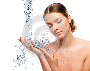 Beautiful woman close up with water splash