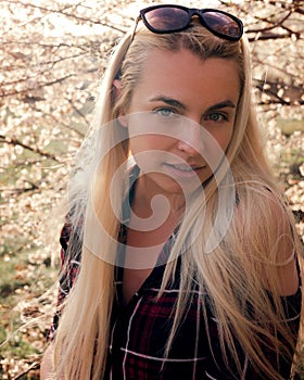 beautiful woman with closed eyes and bare shoulders, outdoor portrait. beauty, lifestyle and fashion concept