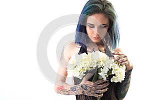 Beautiful woman with colored hair and tattoos