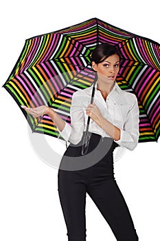 Beautiful woman with colourful umbrella on white b