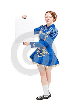 Beautiful woman in costume for irish dance with empty banner