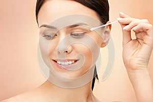 Beautiful woman with cotton bud