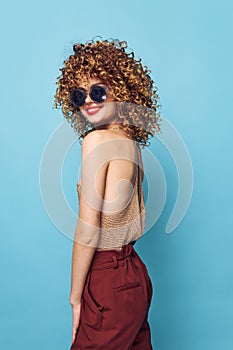 Beautiful woman Curly hair smile red lips fashionable clothes bright makeup