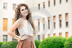 Beautiful woman with curly hair. Urban look