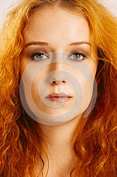 Beautiful woman with curly red hair