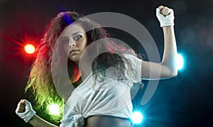 Beautiful Woman Dancing in Disco Spotlights