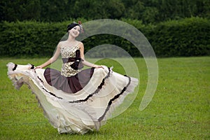 Beautiful woman dancing with formal dress