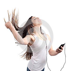 Beautiful woman dancing and listening to the music with headphones