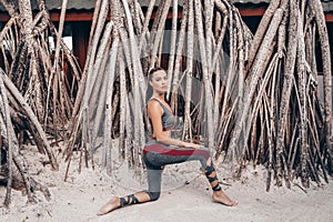 Beautiful woman with dark hair in sport suit relaxing on Maldive