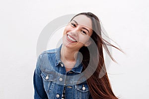 Beautiful woman in denim jacket with long hair blowing