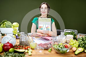 Beautiful woman dietitian with healthy food