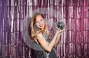 Beautiful woman with disco ball