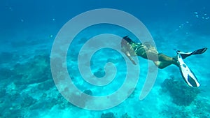 Beautiful Woman Diving Underwater. Snorkeling Girl Swimming in Blue Cristal Clear Water. HD. Similan, Thailand.