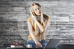 Beautiful woman DJ ing at workplace