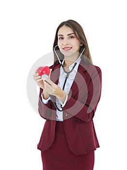 Beautiful woman doctor holding stethoscope touching red heart isolated on white background