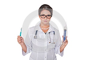 Beautiful woman doctor with syringe, scalpel and stethoscope isolated