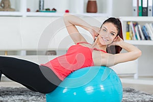 Beautiful woman doing exercice at home