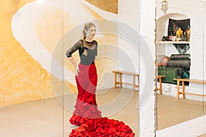 beautiful woman doing flamenco dance rehearsal at a studio