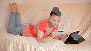 Beautiful woman doing online shopping at home