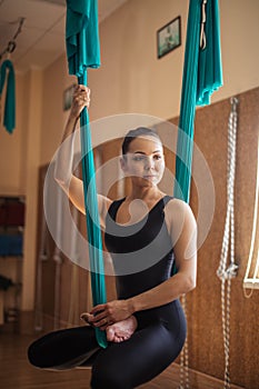 Beautiful woman doing relaxation exercise in the modern gym