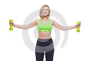 Beautiful woman doing sport exercise with dumbbells