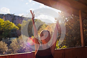 Beautiful woman doing yoga in the morning park. The concept of a healthy lifestyle outdoors. Sport. Nature portrait woman doing