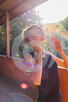 Beautiful woman doing yoga in the morning park. The concept of a healthy lifestyle outdoors. Sport. Nature portrait woman doing