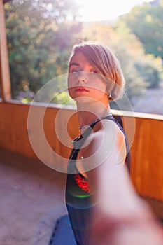 Beautiful woman doing yoga in the morning park. The concept of a healthy lifestyle outdoors. Sport. Nature portrait woman doing