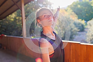 Beautiful woman doing yoga in the morning park. The concept of a healthy lifestyle outdoors. Sport. Nature portrait woman doing