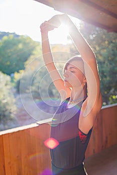 Beautiful woman doing yoga in the morning park. The concept of a healthy lifestyle outdoors. Sport. Nature portrait woman doing