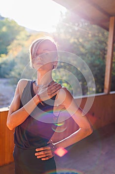 Beautiful woman doing yoga in the morning park. The concept of a healthy lifestyle outdoors. Sport. Nature portrait woman doing