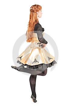 Beautiful woman in dress for Irish dance and mask dancing isolated