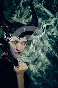 Beautiful woman dressed as Maleficent