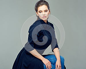 Beautiful woman dressed in black shirtdress