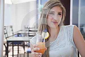 Beautiful woman drinking cocktail