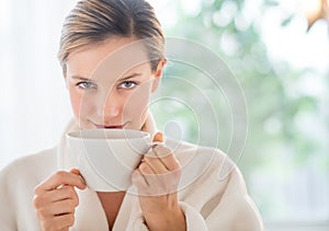 Beautiful Woman Drinking Coffee In Health Spa