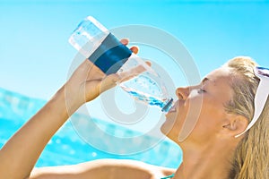 Beautiful woman drinking water