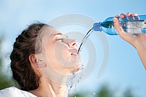 Beautiful woman drinking water. Thirst