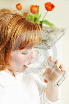 Beautiful woman drinks water