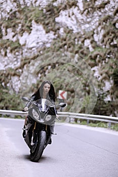 Beautiful woman driving a motorcycle