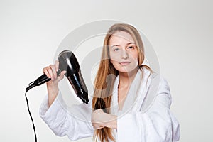 Beautiful woman drying her hair