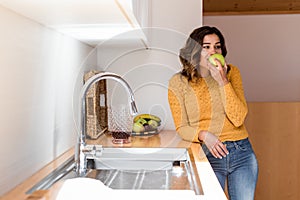 Beautiful woman eating apple