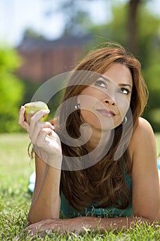 Beautiful Woman Eating An Apple & Thinking