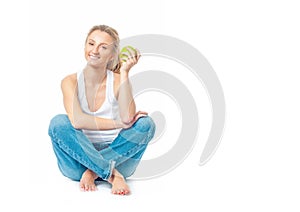 Beautiful woman is eating apple on white background. Healthy lifestyle and diet concept.