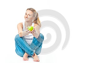 Beautiful woman is eating apple on white background. Healthy lifestyle and diet concept.