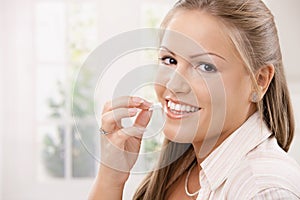 Beautiful woman eating chewing gum