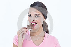 Beautiful woman eating chocolate