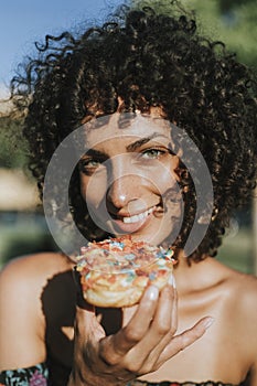 Beautiful woman eating a doughnut