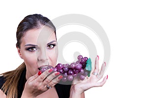 Beautiful Woman eating grapes