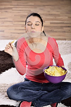 Beautiful woman eating junk food